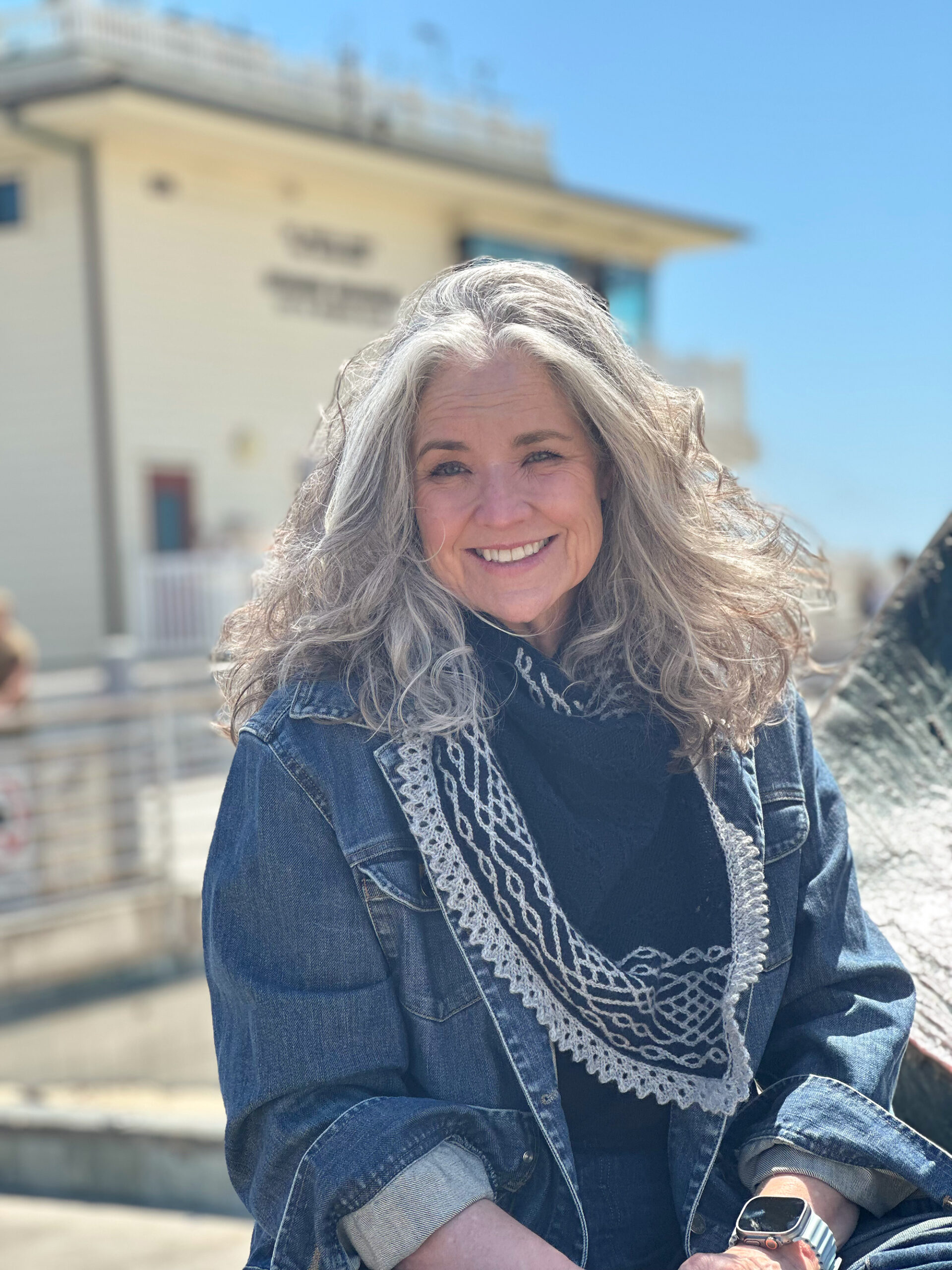 Stephannie modeling the La Jolla Shores Cowl in front of the Hermosa Beach lifeguard station